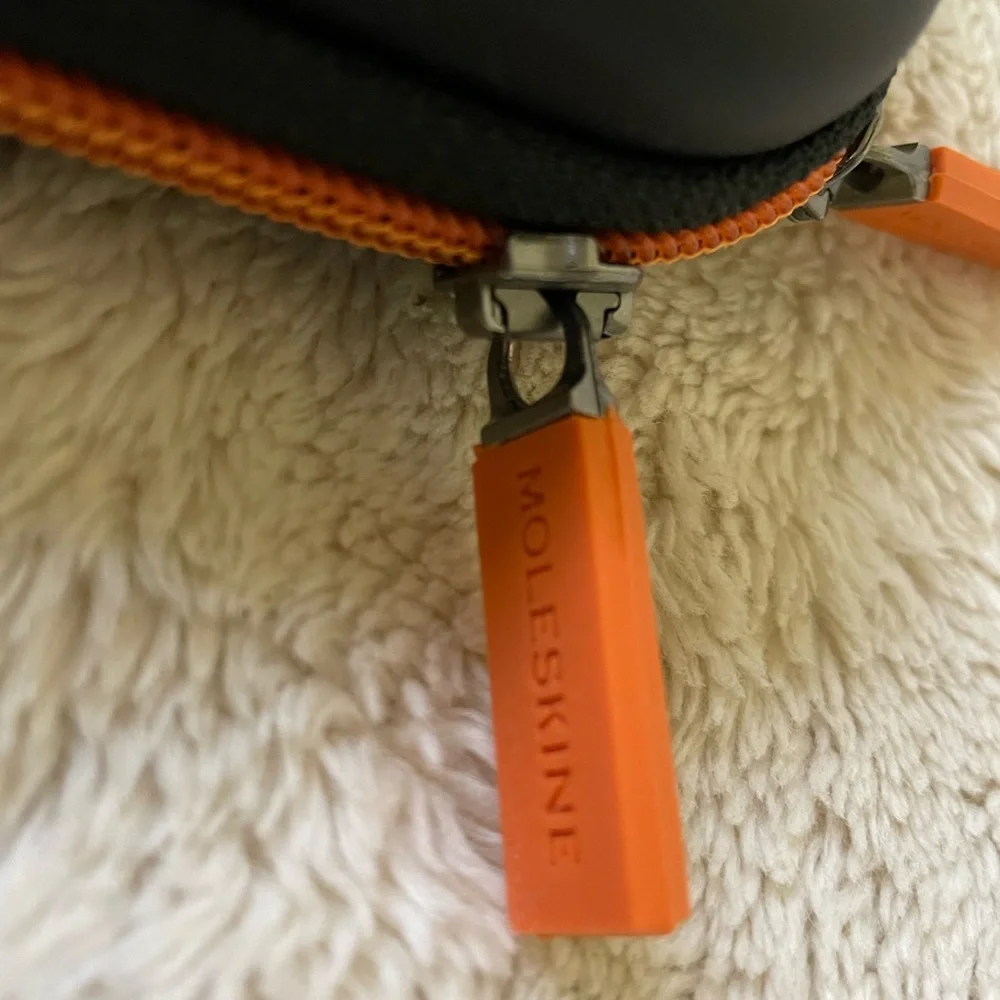 Moleskine 12” diameter for tablet/iPad, black w/ orange zipper